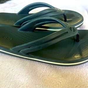 CROCS black with white trim Flip Flops